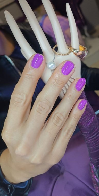 a woman's hands with red painted nails